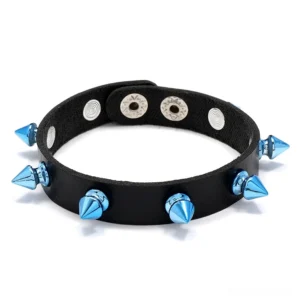 Blue spike gothic leather cuff bracelet flat lay with conical metal rivets, overhead view on white background