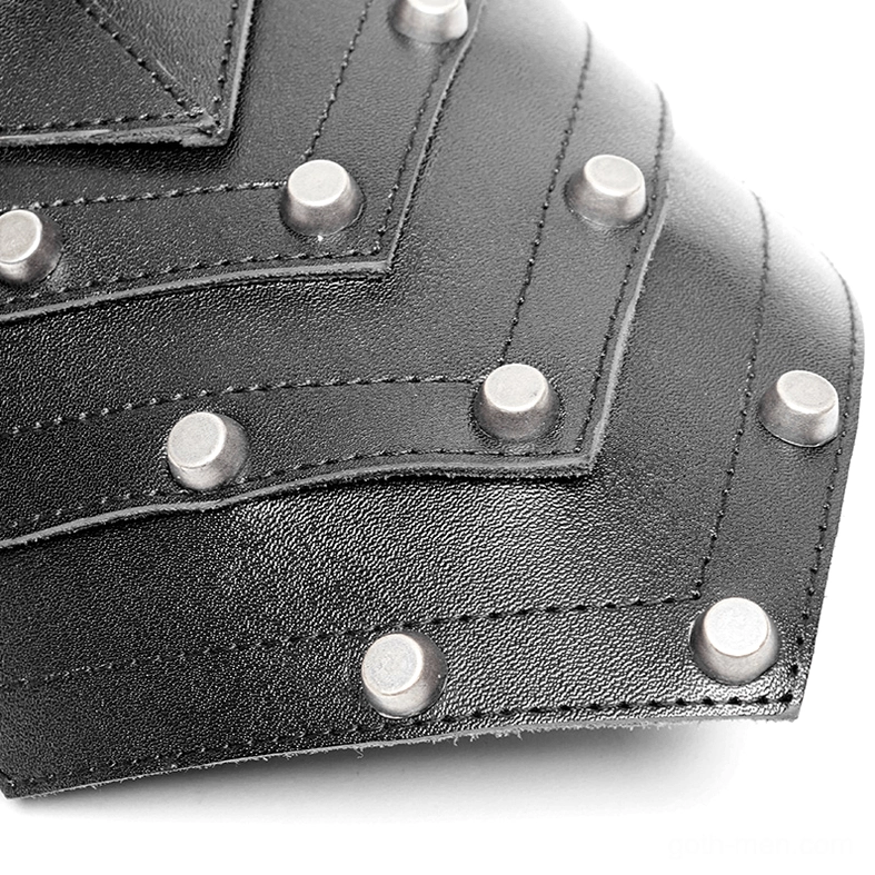 Detailed texture shot of black leather spiked shoulder harness with metal rivets and construction quality