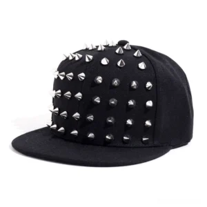Gothic spike snapback baseball cap with silver cone spikes on black canvas fabric, front three-quarter view
