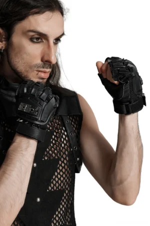Male model wearing black gothic spiked fingerless gloves with hard shell armor protection, full body front view