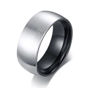 Matte brushed stainless steel band ring with polished black inner coating, three-quarter view showcasing geometric 8mm width and minimal gothic aesthetic