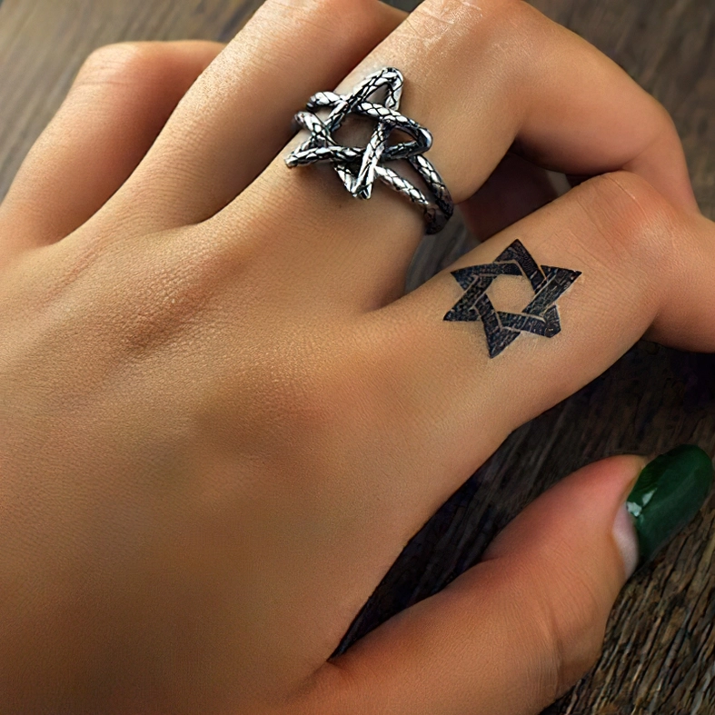 Pentagram ring on finger styling gothic alternative fashion jewelry