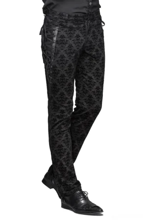 Male model wearing gothic steampunk black slim-fit pants with damask pattern and side lace-up corset details, full side view
