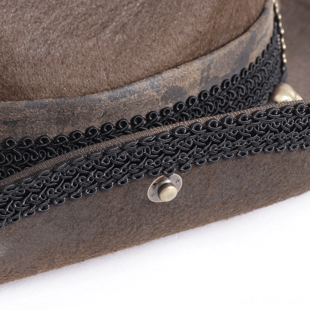 Gothic steampunk cowboy hat construction detail showing gear ornaments and feather attachment