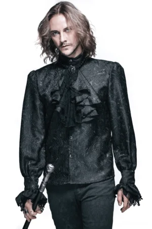 Front view of black gothic steampunk men's shirt with ruffled jabot collar and intricate jacquard pattern worn by male model