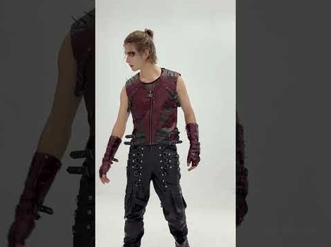 Male model wearing complete gothic steampunk outfit featuring burgundy vest and matching studded fingerless gauntlet gloves, full-length frontal pose