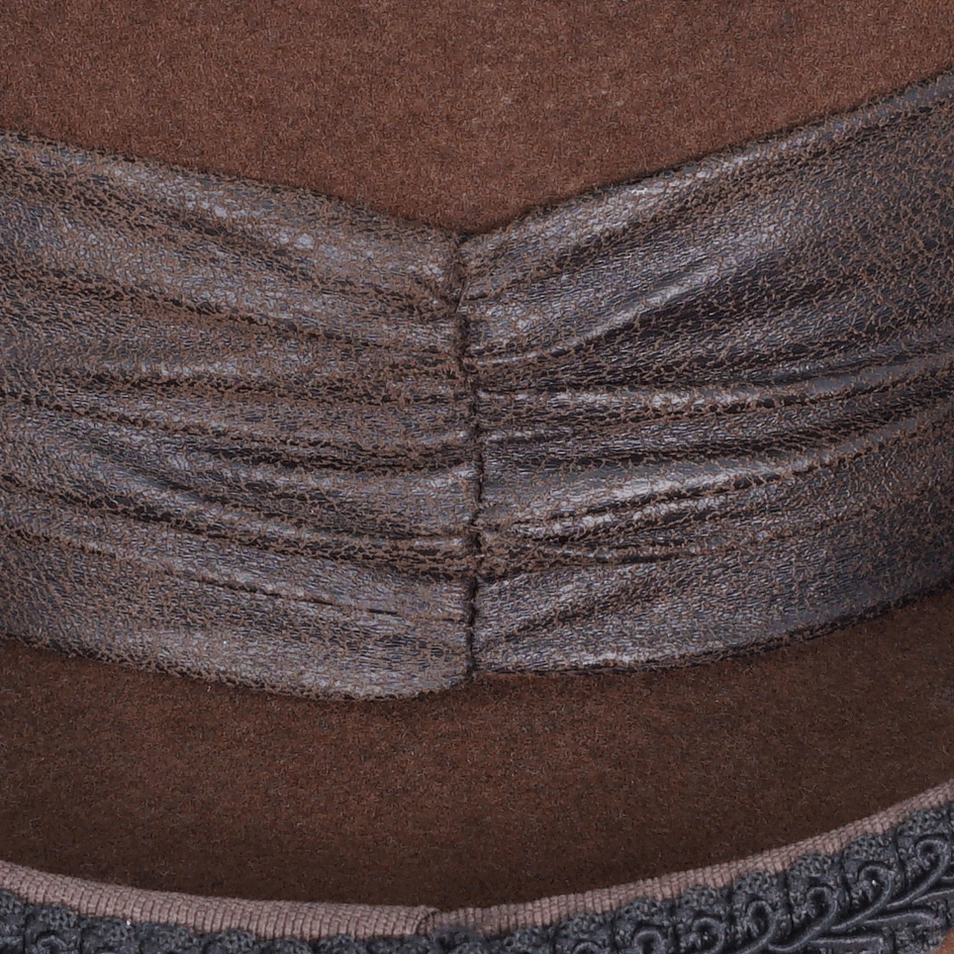 Front-facing detailed view of gothic steampunk top hat showing cameo brooch positioning and gear ornamentation placement