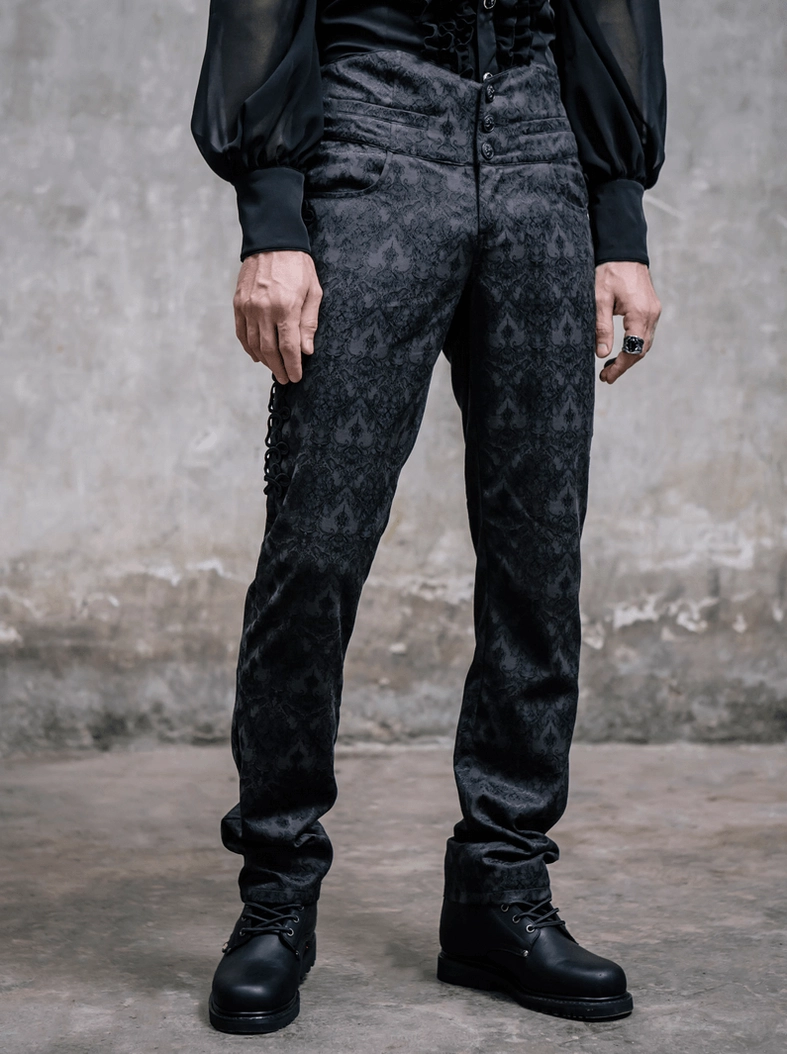 Full front view black jacquard gothic steampunk trousers on male model with high waist and combat boots
