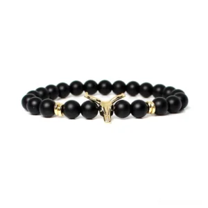 Gold-tone bull head centerpiece on black beaded men's bracelet, gothic charm jewelry with metal finish