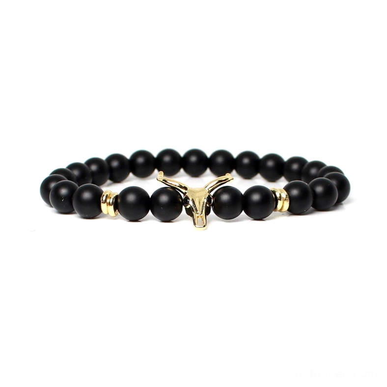 Gold-tone bull head centerpiece on black beaded men's bracelet, gothic charm jewelry with metal finish