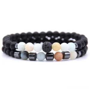 Warm-toned gothic stone beaded bracelet pair with black matte beads and paved decorative bead centerpiece