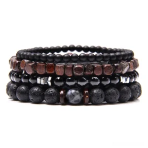 Multi-layer gothic stone and wood beaded bracelet stack set - black polished and natural wood bead combination with metal spacers, flat lay top view
