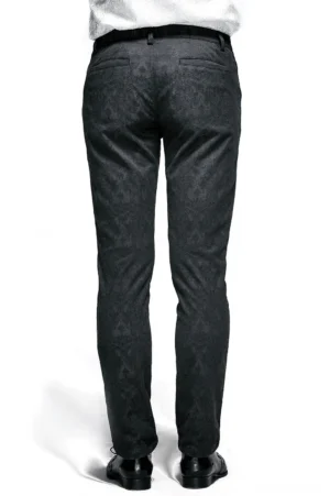 Rear view of black gothic pants on male model, displaying back pockets, belt loops, and jacquard fabric texture