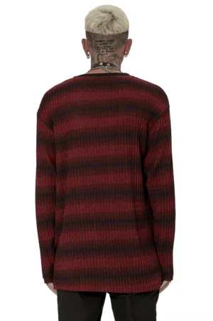 Back view of men's red and black striped gothic knit sweater showing relaxed drop shoulder fit