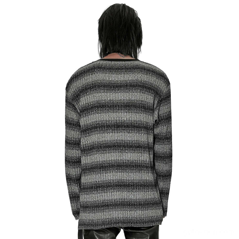 Back view of monochrome striped gothic sweater displaying loose fit silhouette and full-length sleeves in gradient stripe pattern