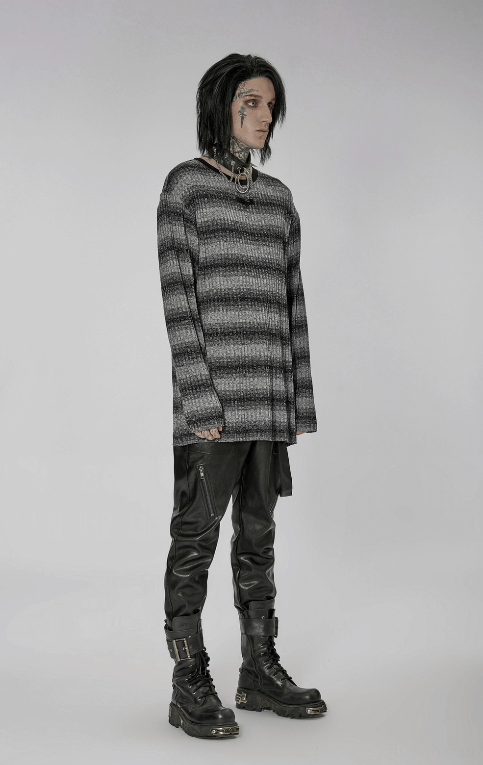 Alternative front angle view of monochrome striped gothic sweater highlighting loose fit and metal hardware at neckline