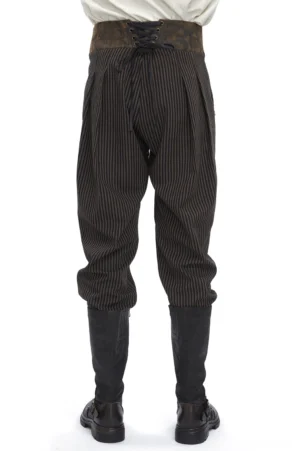 Rear view of gothic high-waist trousers showing lace-up back closure and pleated relaxed legs
