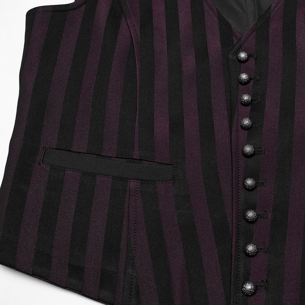 Close-up of black striped gothic waistcoat showing decorative metal buttons, stripe fabric texture, and waist pocket detail