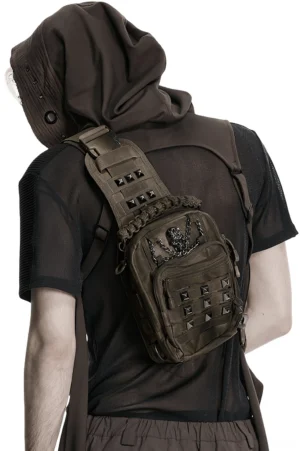 Back wearing view of tactical gothic crossbody bag with studded details on male model with hooded outfit