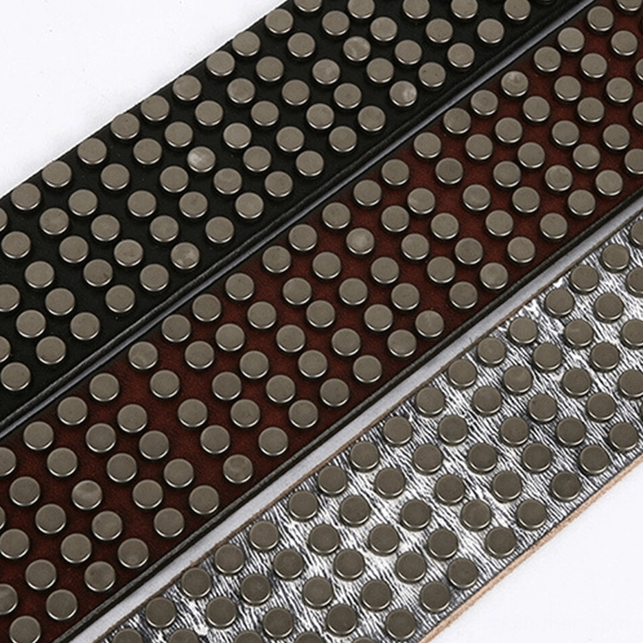 Studded leather belt showing metal rivet gradient from buckle through strap length