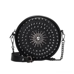 Black gothic studded circular crossbody bag with sunburst rivet pattern and rhinestone decoration, front flat lay view