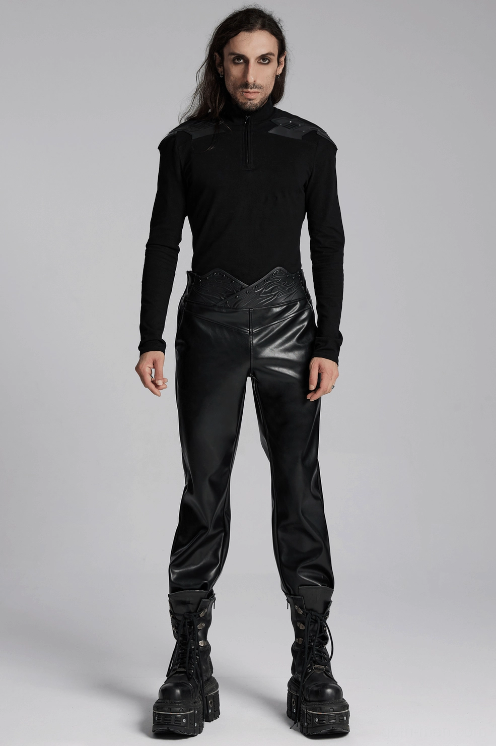 Black faux leather pants full-body styled view, complete silhouette showcasing fitted cut and tapered leg