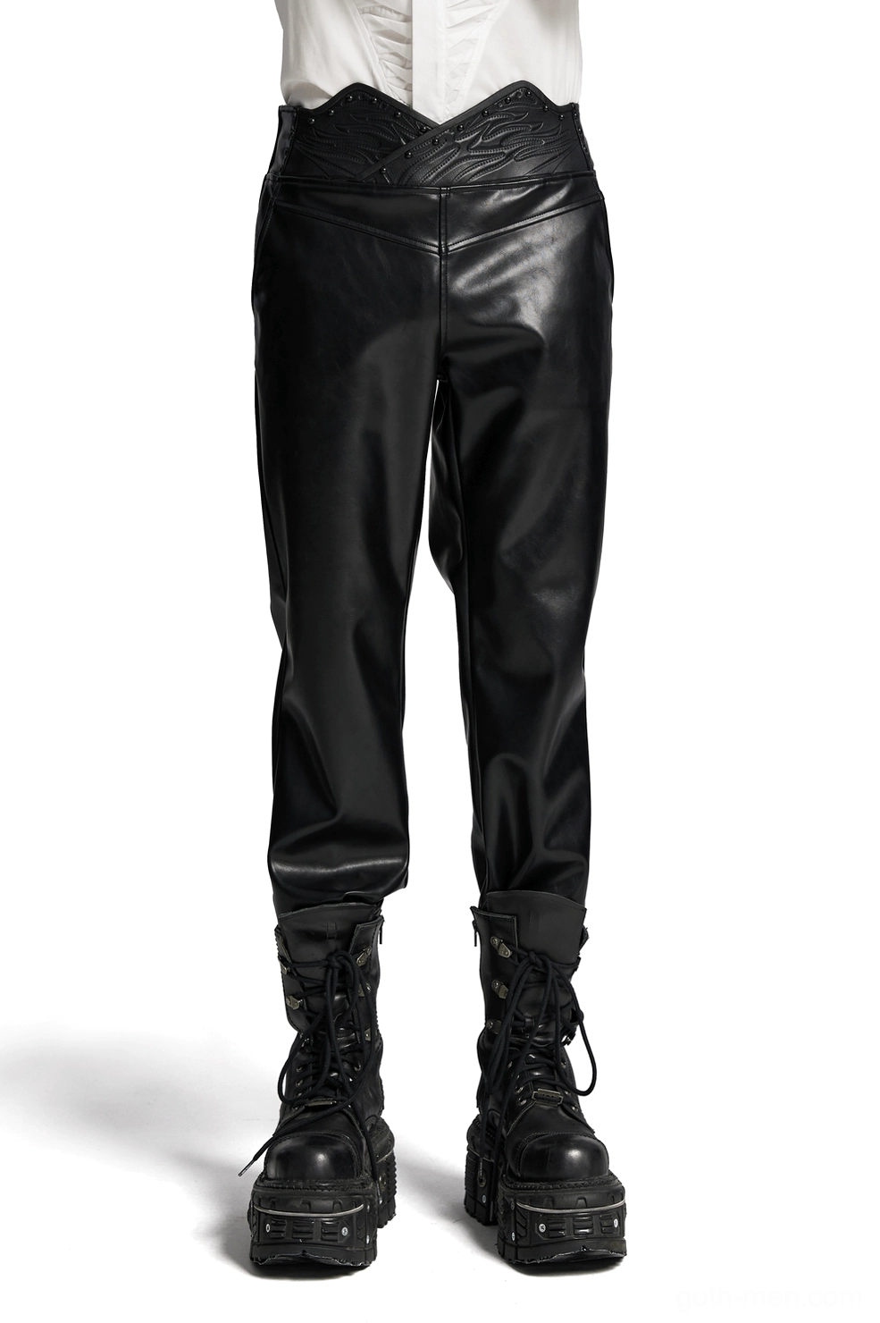 Male model wearing black gothic studded faux leather pants with 3D curved waistband, front full-body view, studio lighting