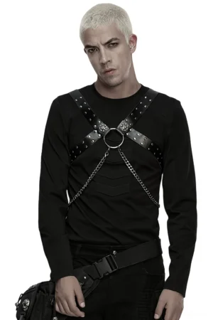 Black studded PU leather chest harness front view on model wearing long-sleeve top, metal chain accents visible