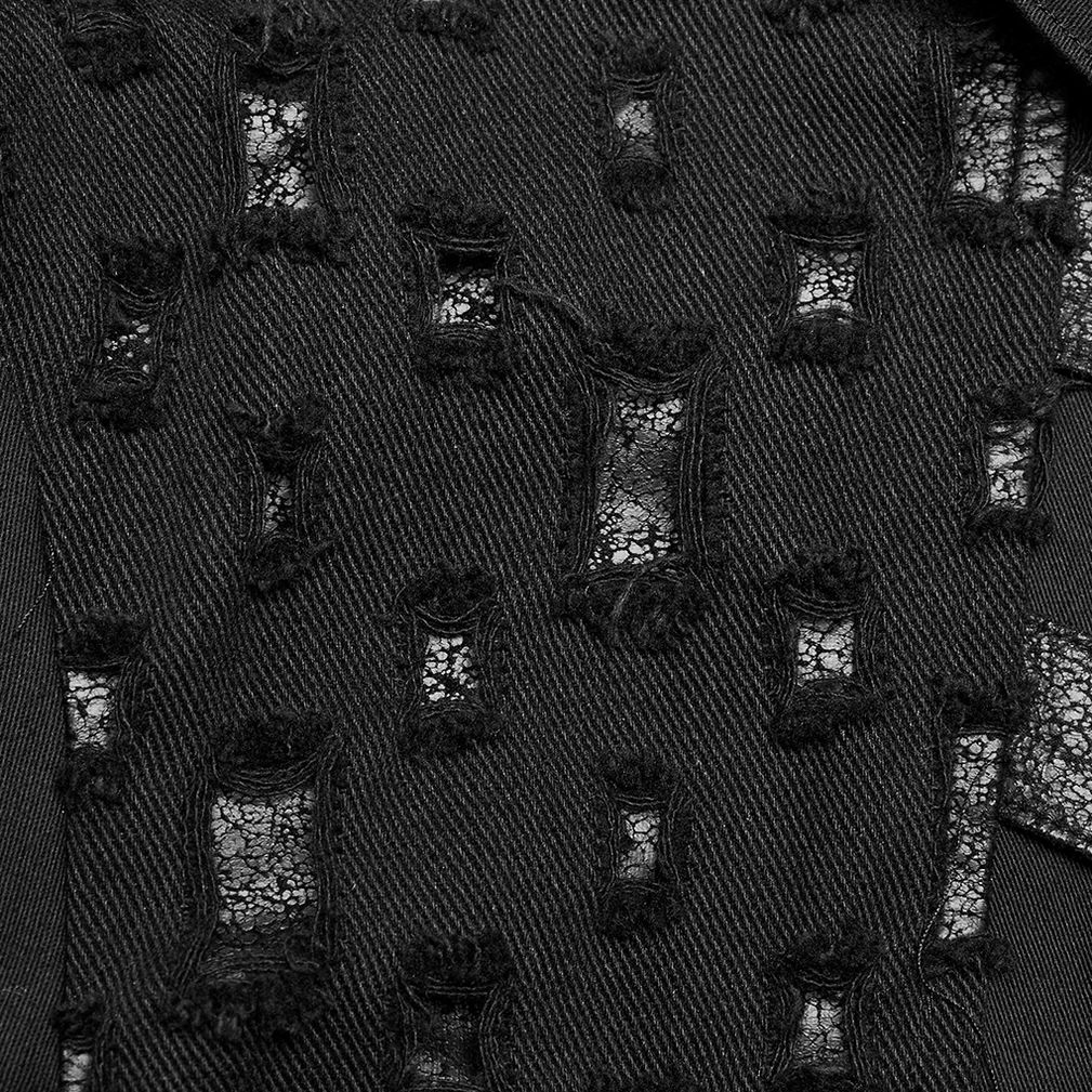 Black gothic shirt chest fabric close-up showing distressed cutout holes, cracked faux leather trim, and frayed textile edges