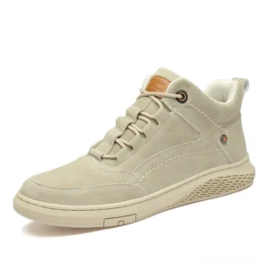 Men's beige suede gothic ankle boots with flat laces and branded collar tag, front three-quarter view