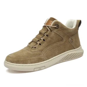 Men's brown suede gothic ankle boots with lace-up closure and rubber sole, front three-quarter view on white background