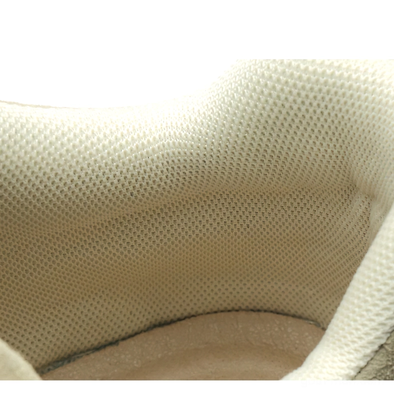 Interior view of gothic suede ankle boot showing breathable mesh fabric lining and padded collar