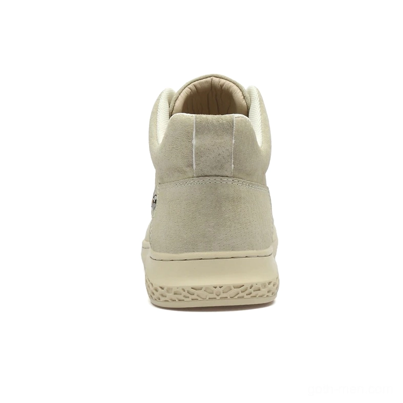 Rear view of beige suede gothic ankle boots showing low flat heel and closed collar construction
