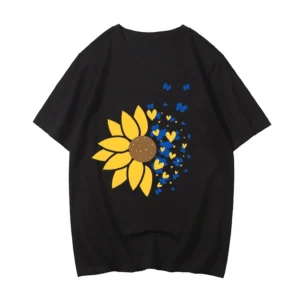 Black gothic sunflower oversized cotton tee with yellow and heart print, front view flat lay