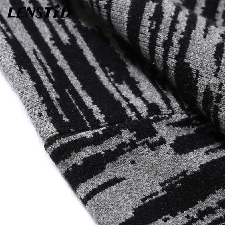 Detailed view of bold black-gray woven patchwork pattern on gothic sweater fabric showing tight knit texture