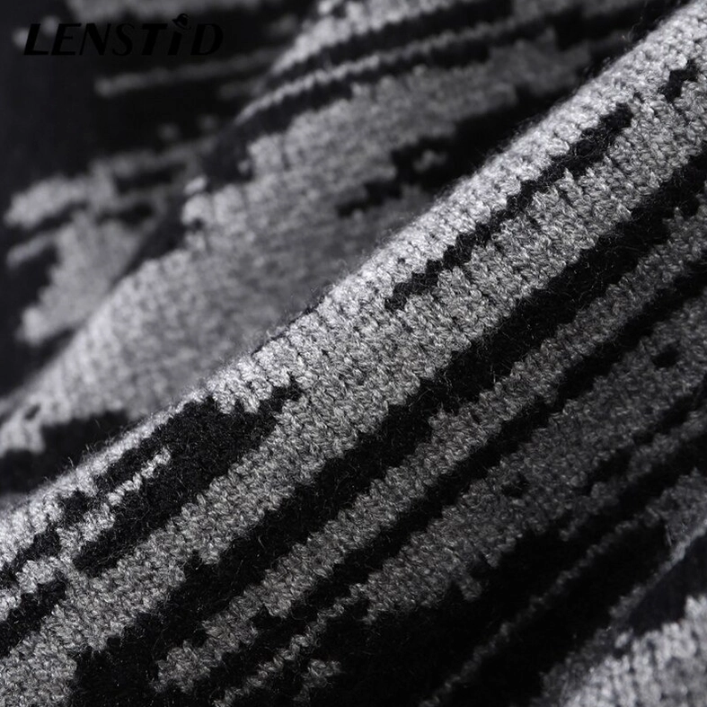 Macro view of soft knitted fabric with abstract striped pattern on gothic oversized sweater