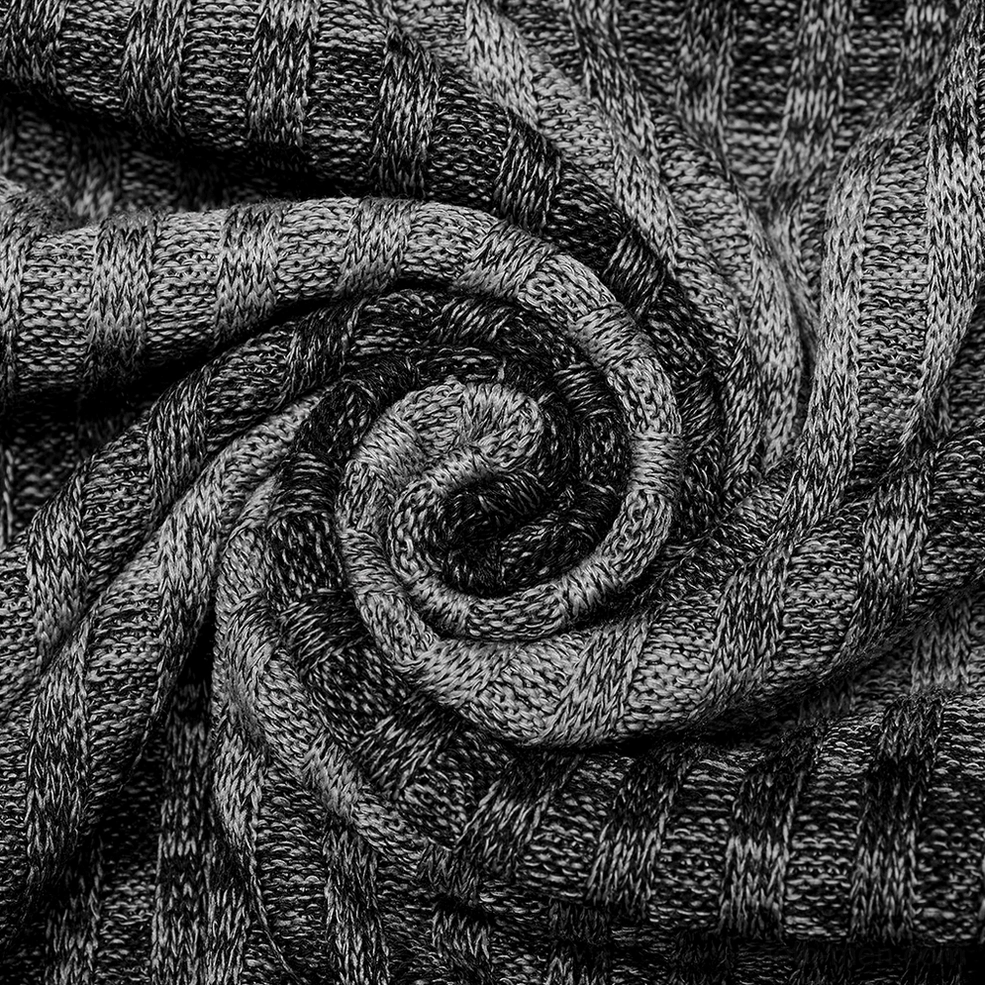 Close-up texture detail of monochrome striped gothic sweater showing vertical ribbed knit construction with mixed gray and black yarns