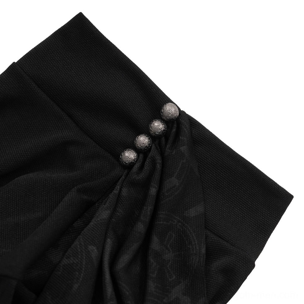 Close-up detail of ruched black knit cuff with metal bead decorative fasteners and gothic hardware accents on long sleeve