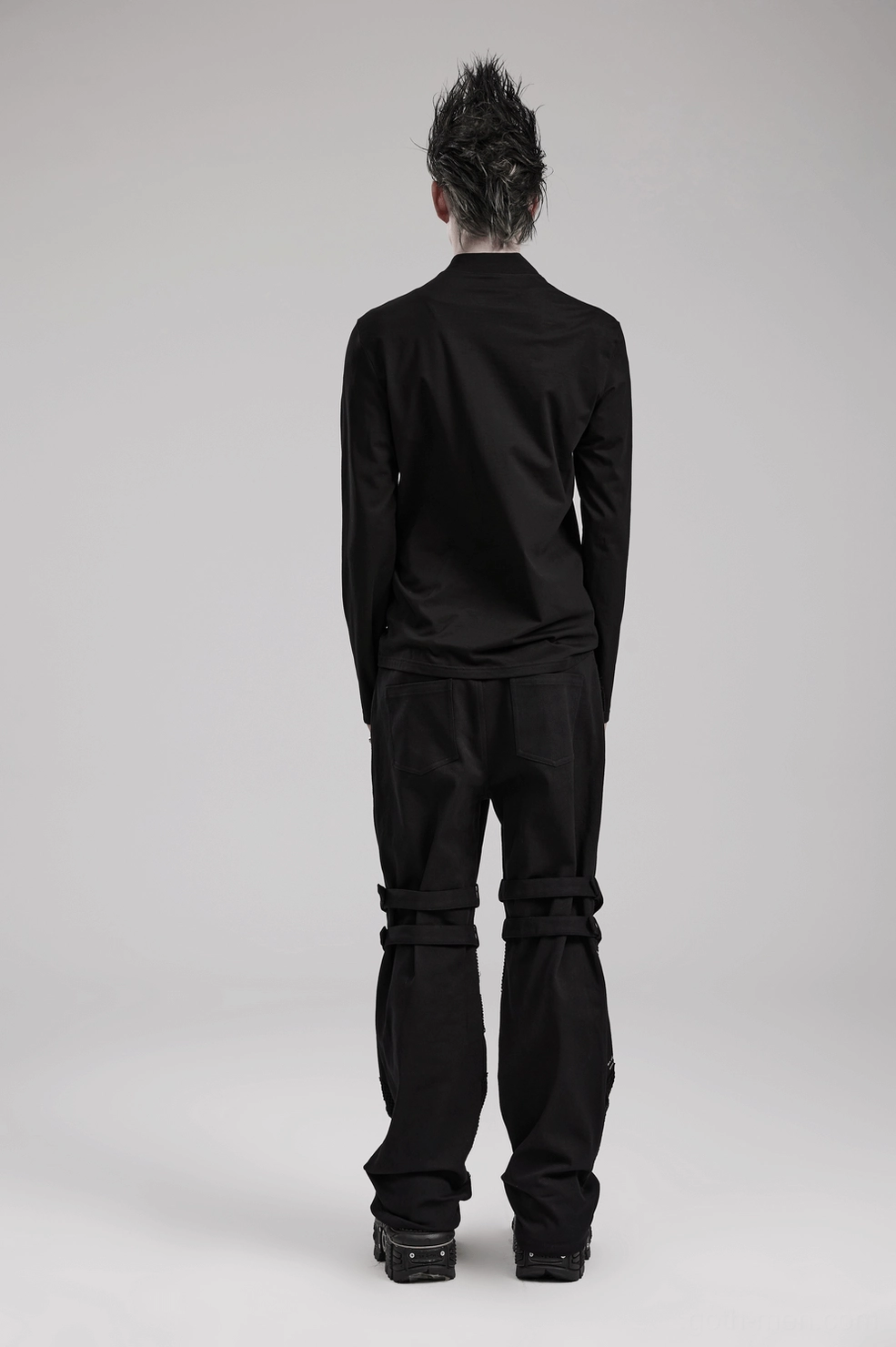 Black gothic sweatshirt showing faux leather chest panel integration with cotton knit body contrast