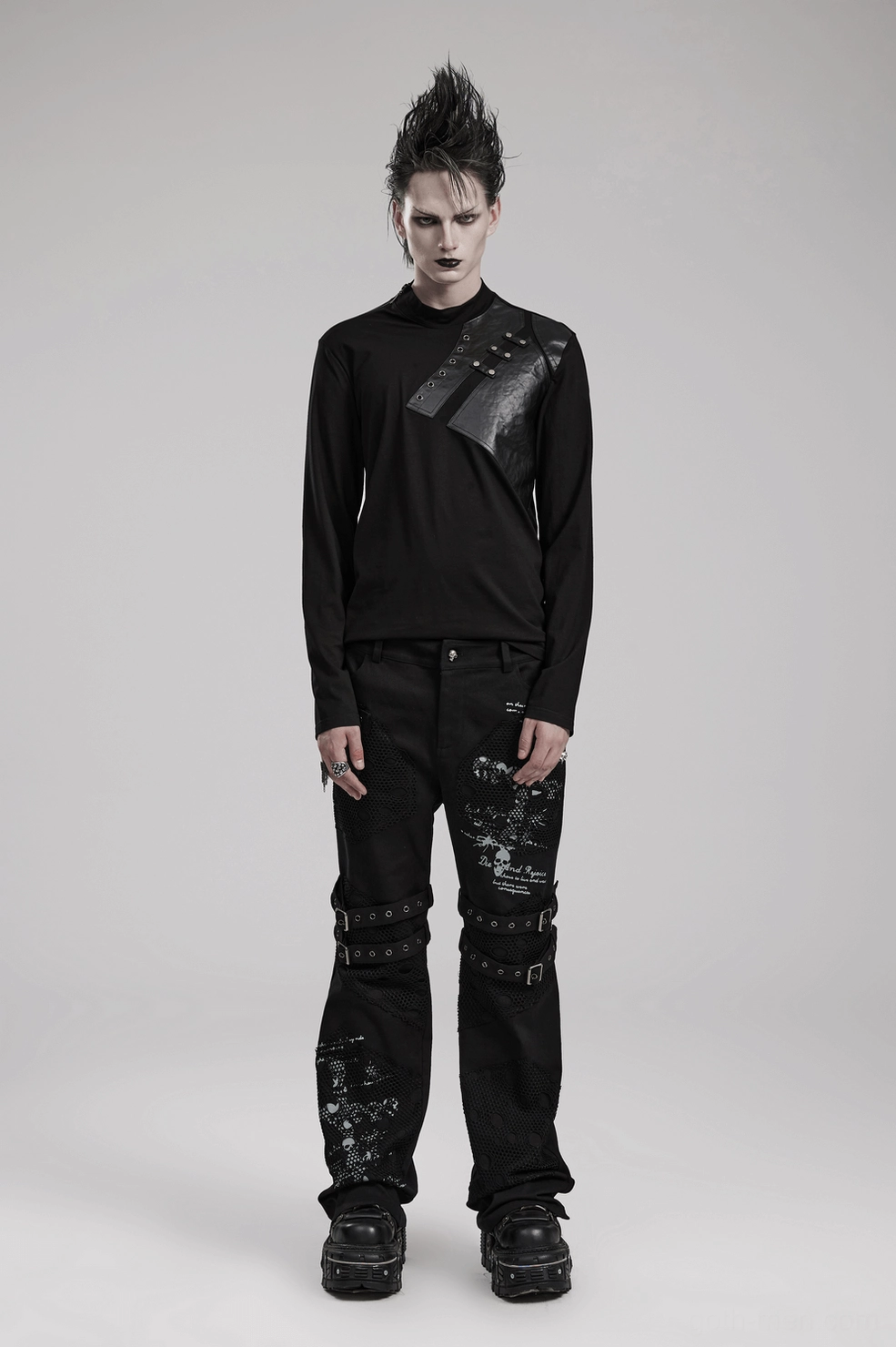 Geometric metal rivet pattern detail on black gothic sweatshirt chest showing industrial craftsmanship