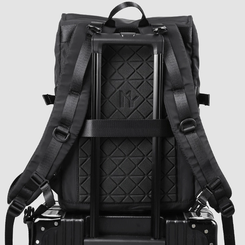 Black nylon tactical backpack back three-quarter view with luggage fix strap and breathable padding