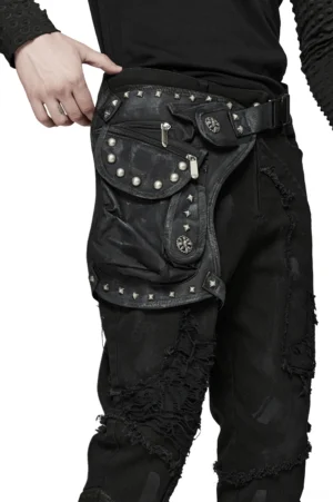 Black punk leg bag with star rivets and zippered pockets worn by male model from rear angle, displaying distressed fabric and tactical design