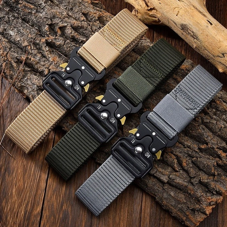 Tactical nylon belts in neutral tones with metal quick-release buckles - flat lay view