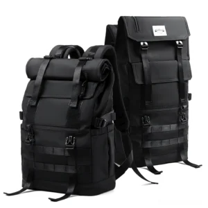 Black gothic tactical roll-top backpack dual three-quarter studio view showcasing water-resistant nylon and molle webbing details