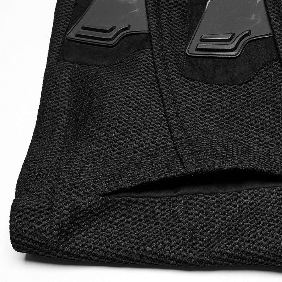 Close-up texture detail of gothic tactical vest, black woven mesh fabric, stitched seams, suede-like accent patches, construction quality