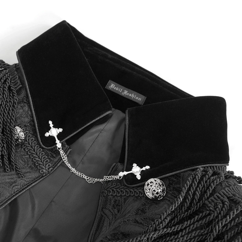 Close-up of velvet stand collar with cross chain collar clip, skull metal buttons, and internal brand tag detail