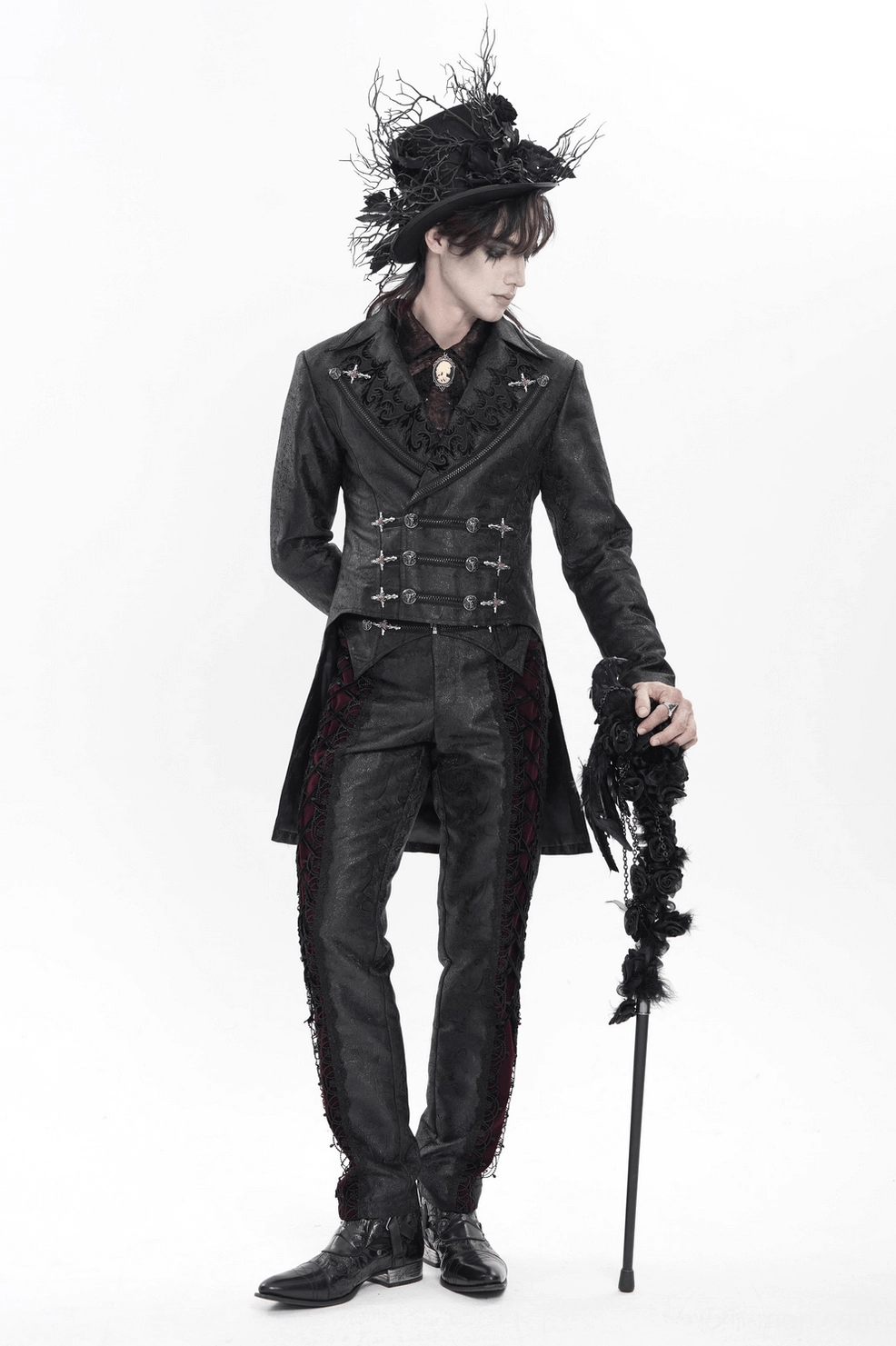 Black gothic tailcoat front detail view - male model showcasing cross buckle hardware, textured lapels, and brocade fabric pattern