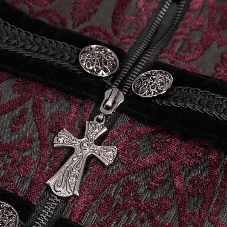 Macro photograph of gothic tailcoat cross-shaped metal zipper pull on velvet trim bands showing damask fabric base and ornate cross pendant detail