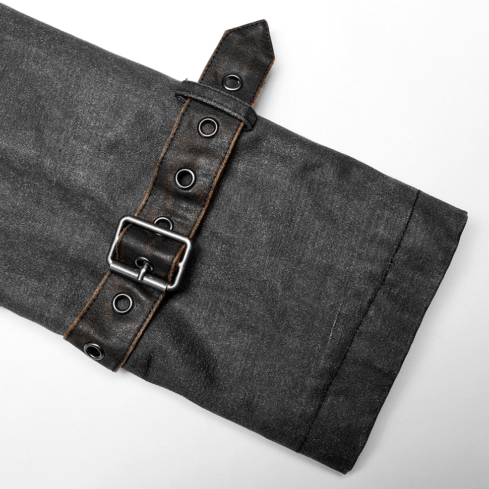 Close-up of distressed gothic tailcoat cuff strap detail showing faux leather strap, metal buckle fastener, and rivet construction