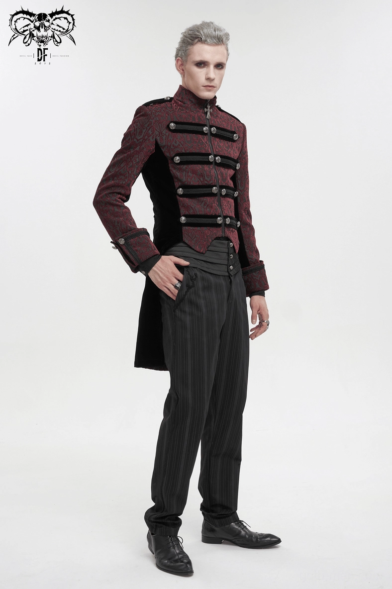 Close-up fabric detail of wine red gothic tailcoat showing embossed damask jacquard weave and black velvet panel contrast